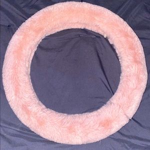 Pink fuzzy steering wheel cover